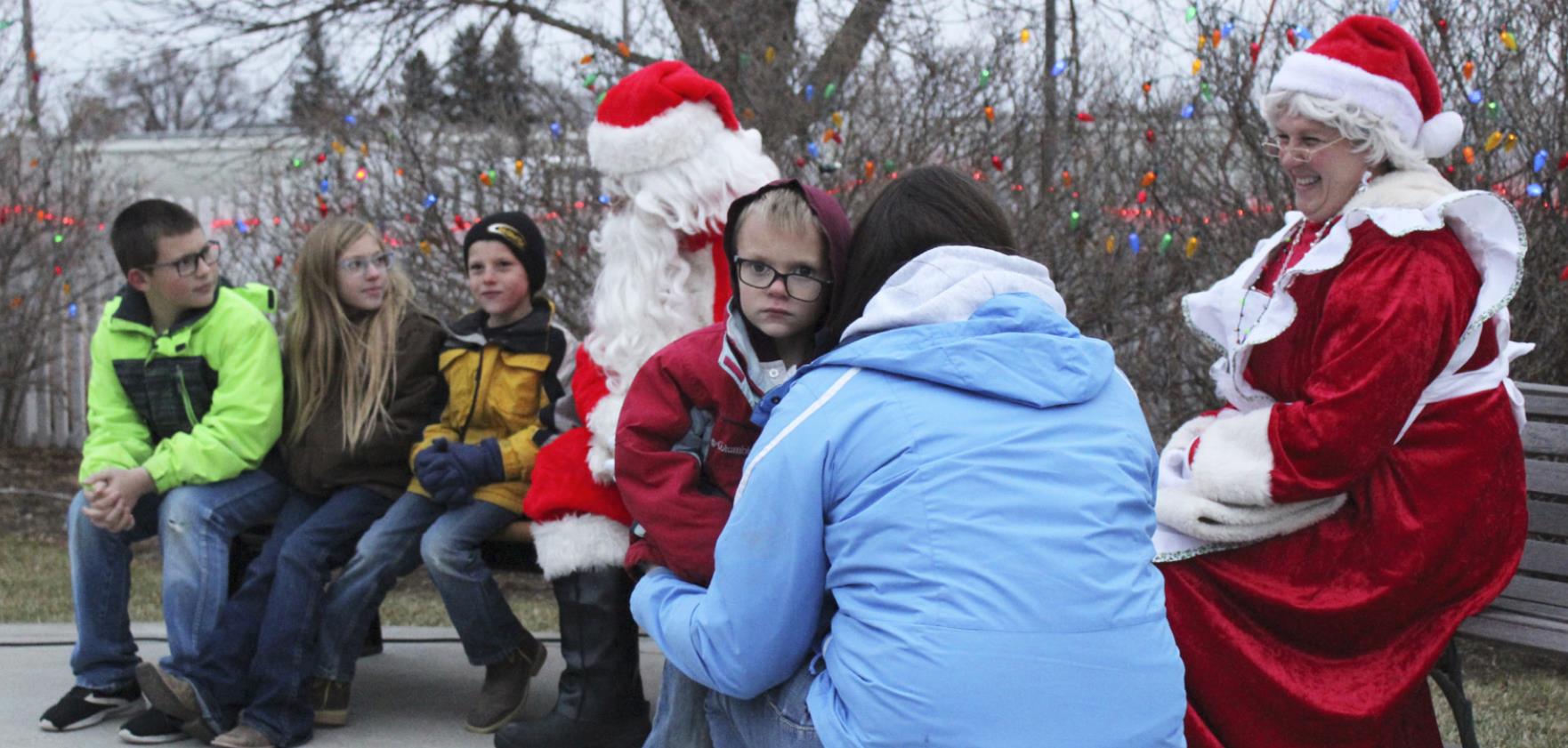 Trent Cox wanted nothing to do with Santa last Thursday when the Mullen Commercial Club brought him to town. Trent clung onto his mom, Erin Cox, while his older siblings Cort, Olivia and Luke talked to Santa.