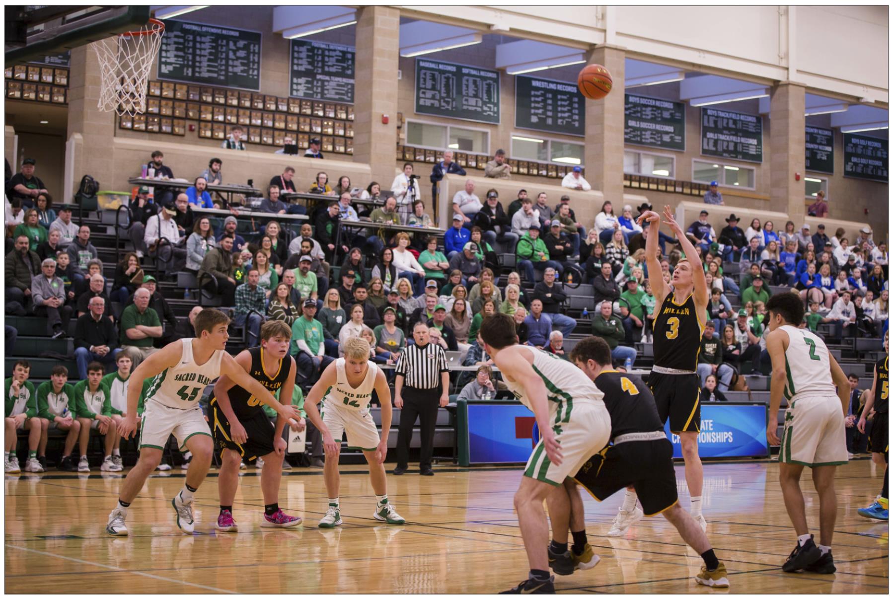 Clayton Moore shoots a free throw, while Cade Groseth (#00), Luke Durfee (#4) and Kyle Finney (#5) get ready to rebound in Lincoln last Tuesday. Megan Andersen