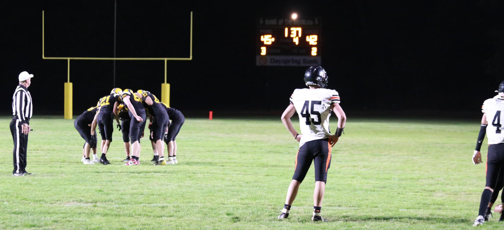 The Broncos huddle up in the last 1:37 left of the game last Friday night. Carolee Brown