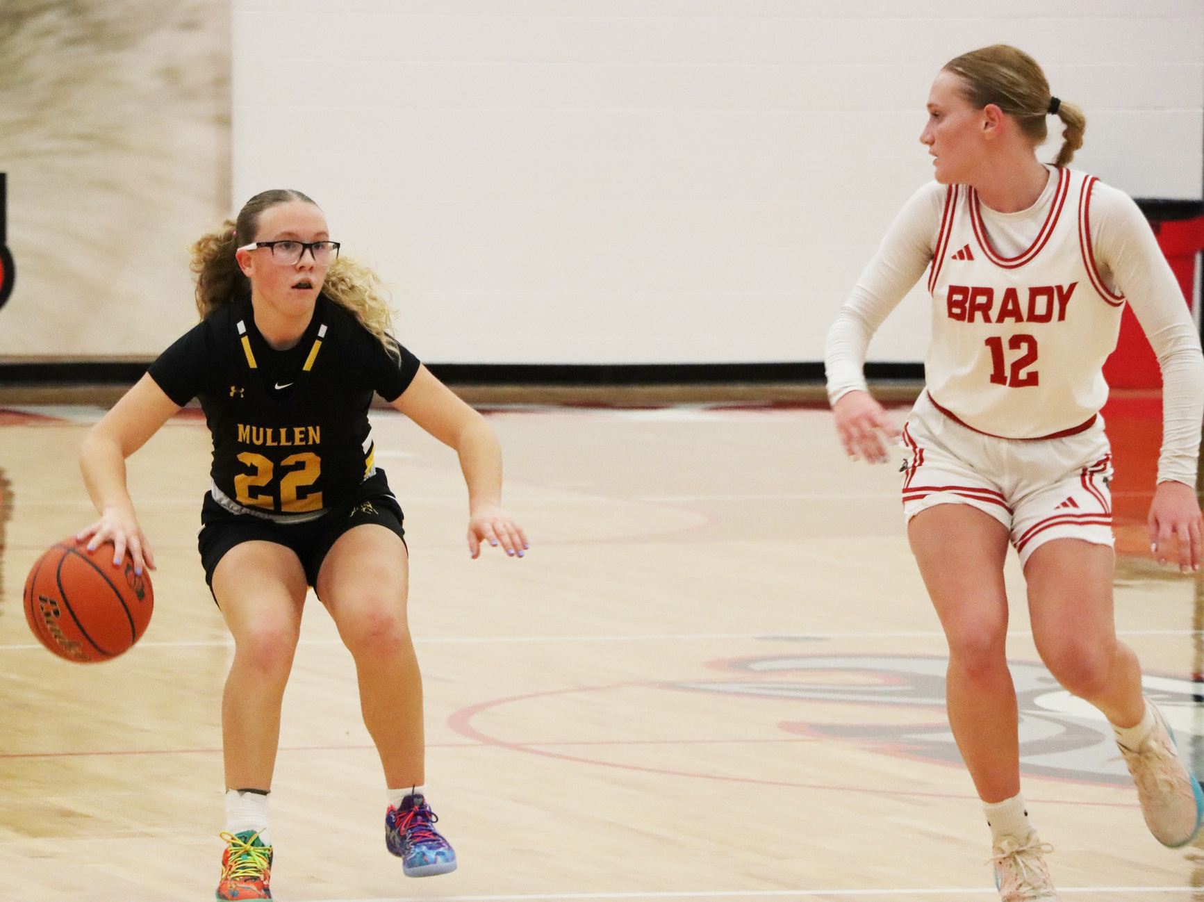 Riley Hegland brings the ball up the court at Brady. Sue Licking