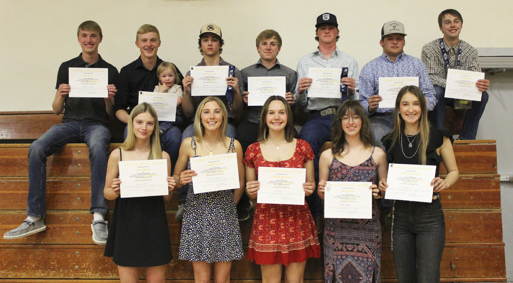 Sportsmanship winners, back l-r: Alex Moore, Clayton Moore (holding future Bronco Beckett Wright), Jeffery Forsen, Kyle Finney, Chase Gracey, Deacon DeNaeyer, Jacob Wingebach. Front: Erika Massey, Peyton Paxton, Ashlyn Simonson, Malia Oltmer, Whitney Jennings. Gerri Peterson