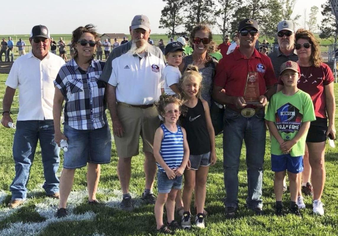 L-r: Steve and Erin Dent, Coach Mike Brown, Steven and Kay Dent with their kids Cylas, Emri, Dailie and Brek and Don and Tina Broekemeier. courtesy photo