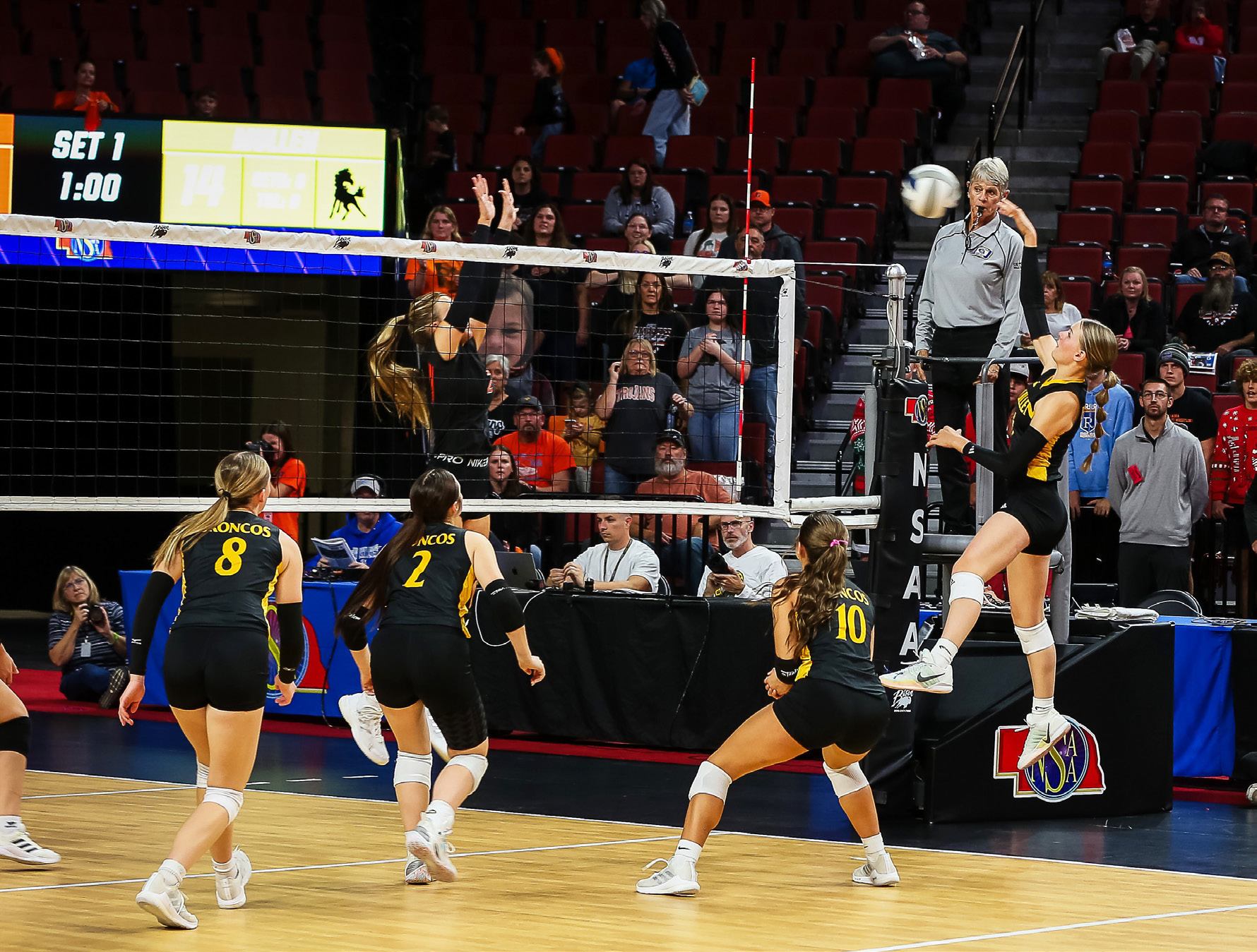 Brynne McCully goes up for a kill at state volleyball last Thursday, with Harper Andersen, Kalli Licking and Ella Rice covering. Megan Andersen