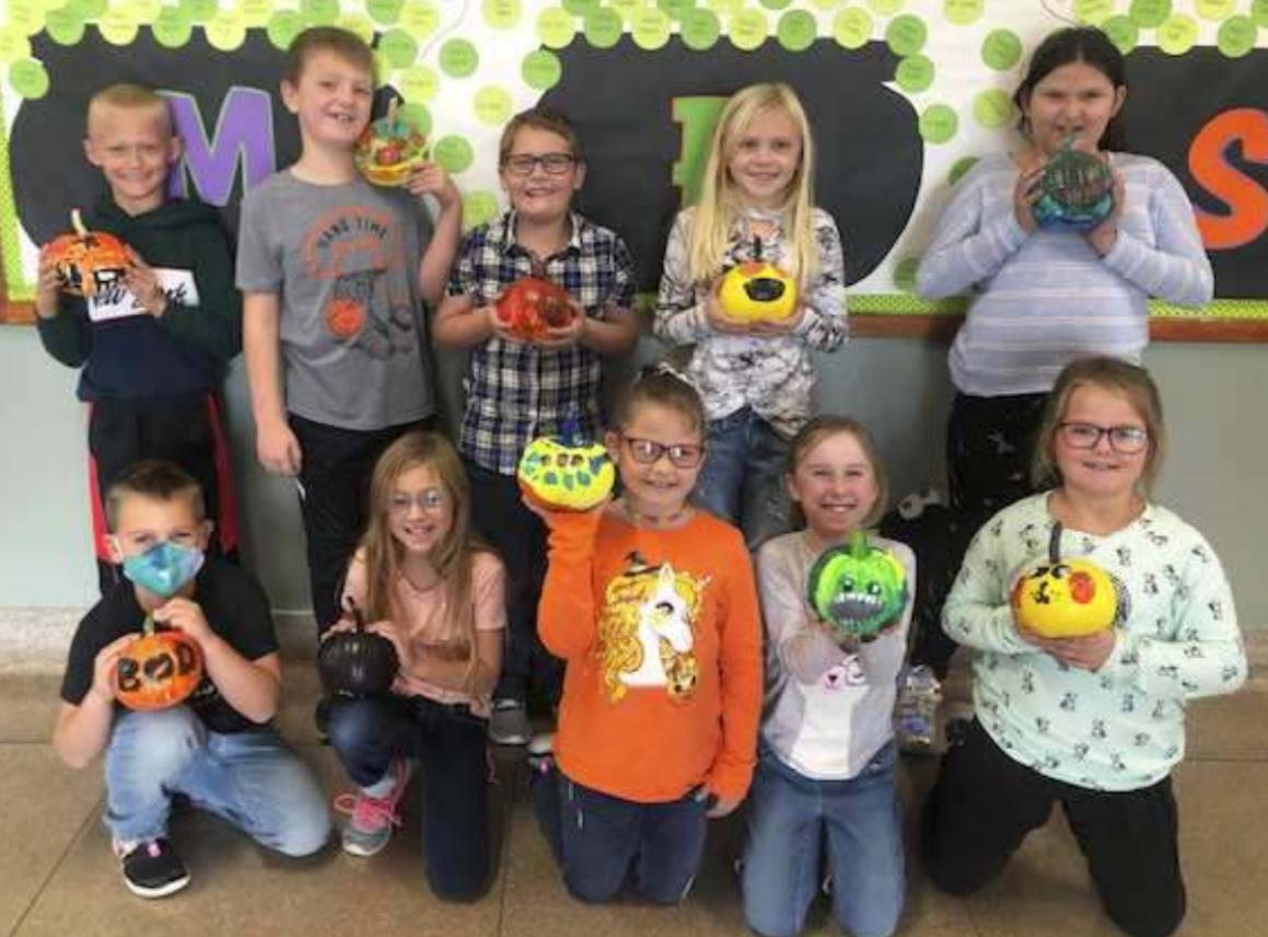Second graders show off pumpkins