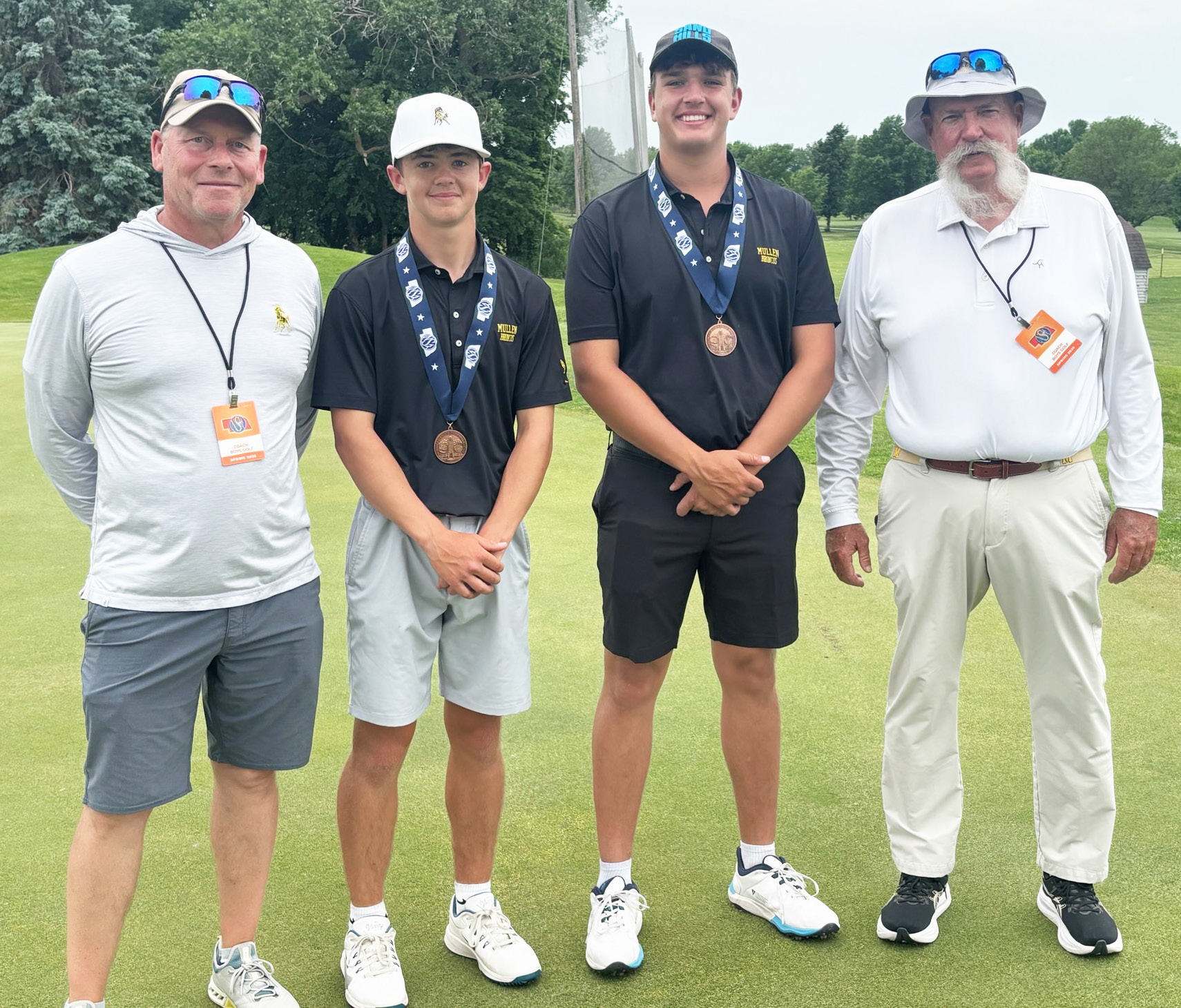 L-r: MHS Assistant Golf Coach Clint Svoboda, Ben Werner, Jacob Walker and Head Golf Coach Mike Brown at State Golf last week. Dominique Werner