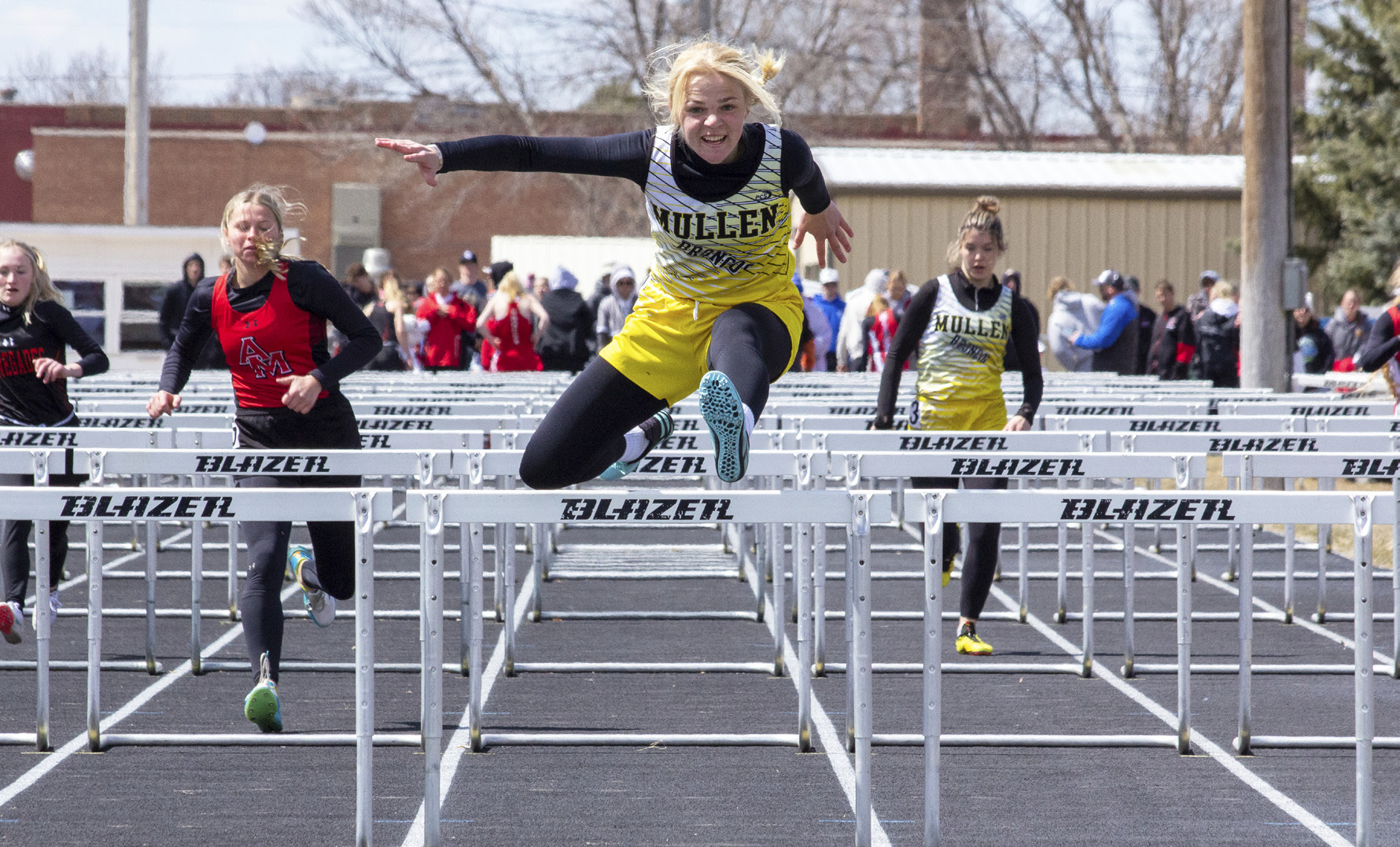 Tierston Moore and Medora DeNaeyer (back right) in the 100 hurdles last week in Arnold. Carolee Brown