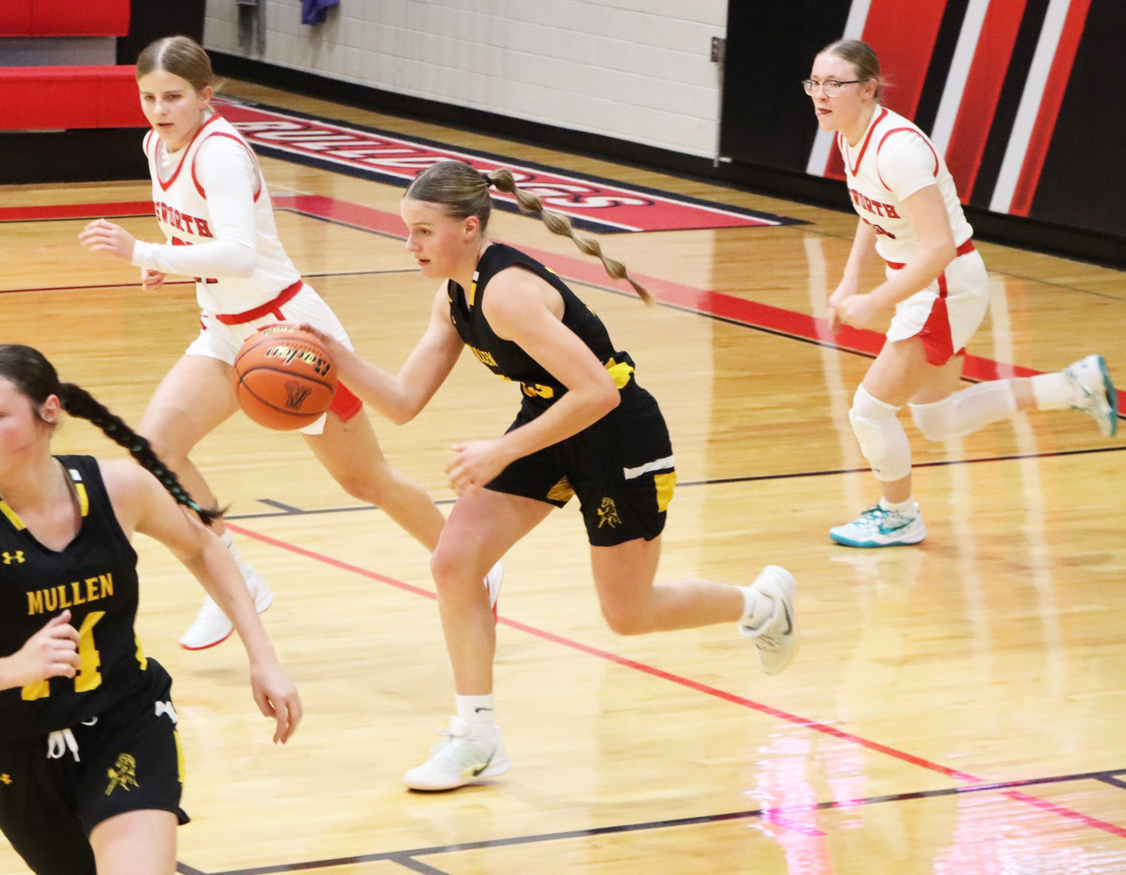 Brynne McCully pushes the ball up the court at Ainsworth. Sue Licking