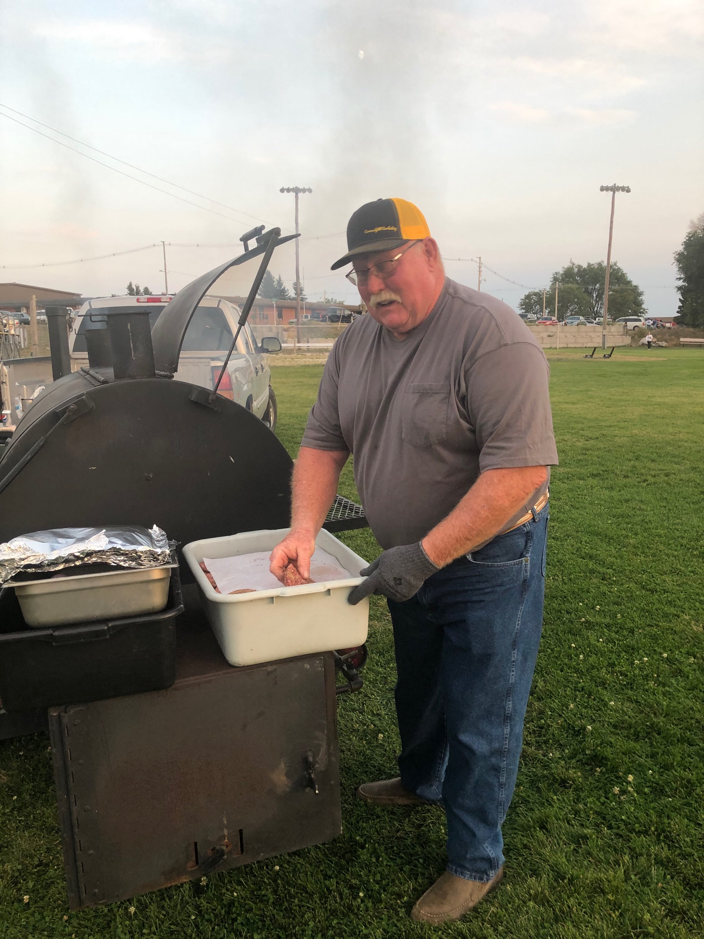 Pat Wright grills burgers at the MOB tailgate this year. Barb McIntosh