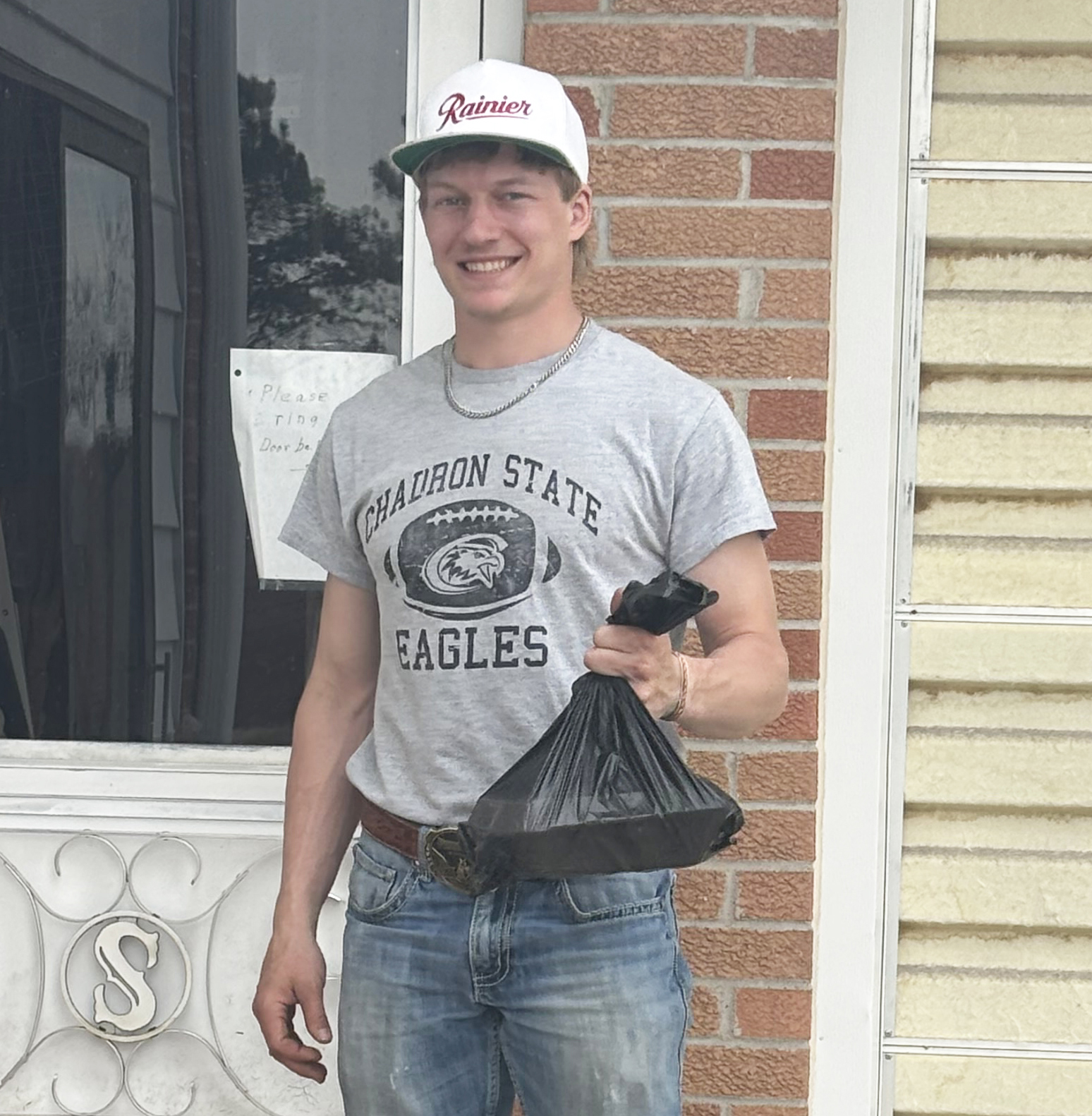 National Honor Society student Justin French, a MHS senior, prepares to deliver a meal last week.  Kara Connealy