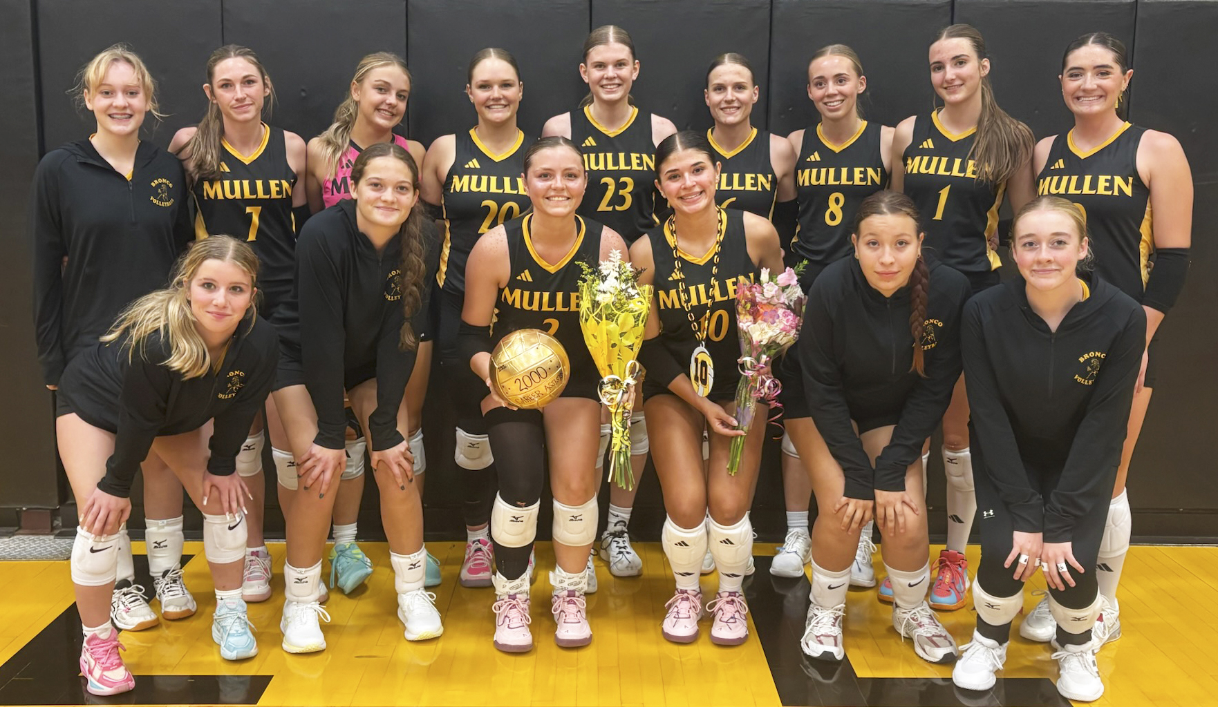 The Lady Bronco volleyball team celebrates with Kalli Licking on achieving 2,000 assists and Ella Rice for surpassing the school record for ace serves last Thursday. Back, l-r: Jillian Taylor, Breckyn Burney, Kaisley Phipps, Emerson Thorberg, Chloe Newman, Brynne McCully, Harper Andersen, Abigail Gracey, Jenna Donohoe. Front: Jailyn Miller, Ava Kvanvig, Kalli Licking, Ella Rice, Annabelle Casillas, Kassidy Cheever. 