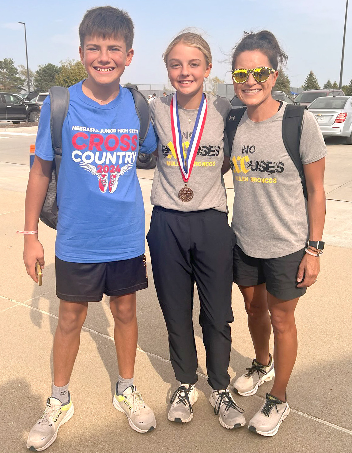 L-r: Braylon Kuncl, Kaisley Phipps and Coach Janie Kuncl at the Nebraska Junior High State Cross Country Meet. Jordyn Phipps