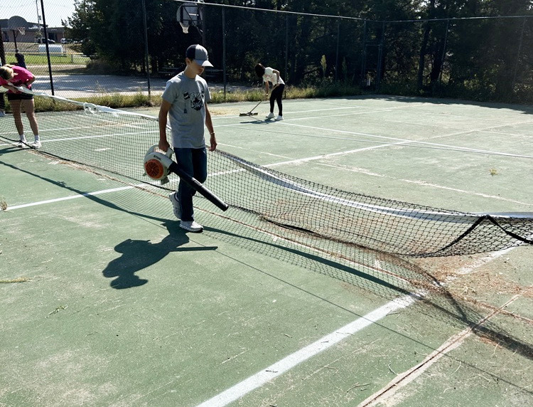 Tennis court cleaned up by students