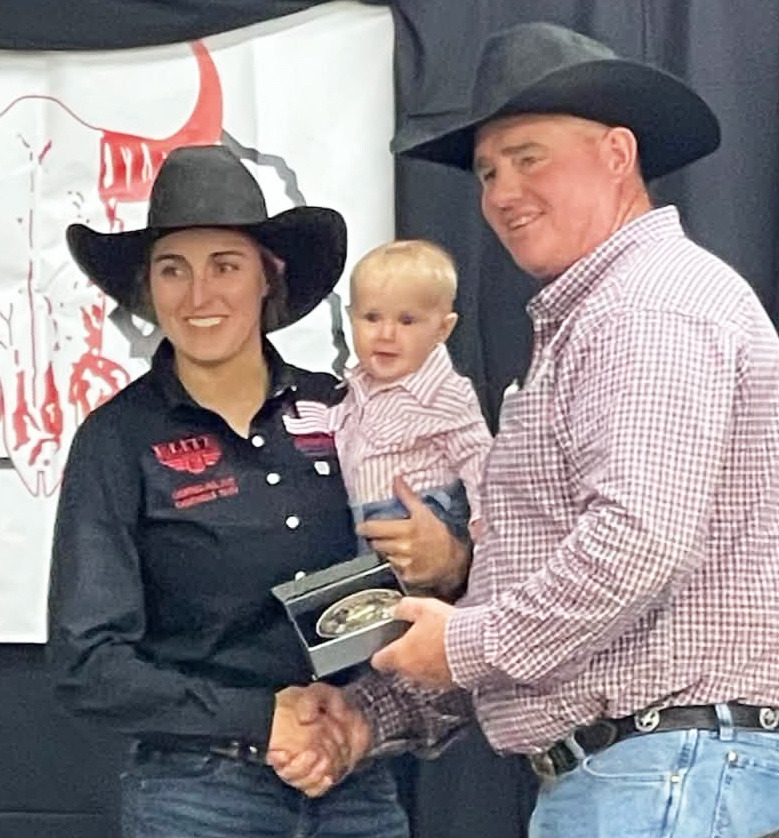 Brittni Bradley, holding her six-month-old daughter Josi, being awarded the All-Around. Traci McCully