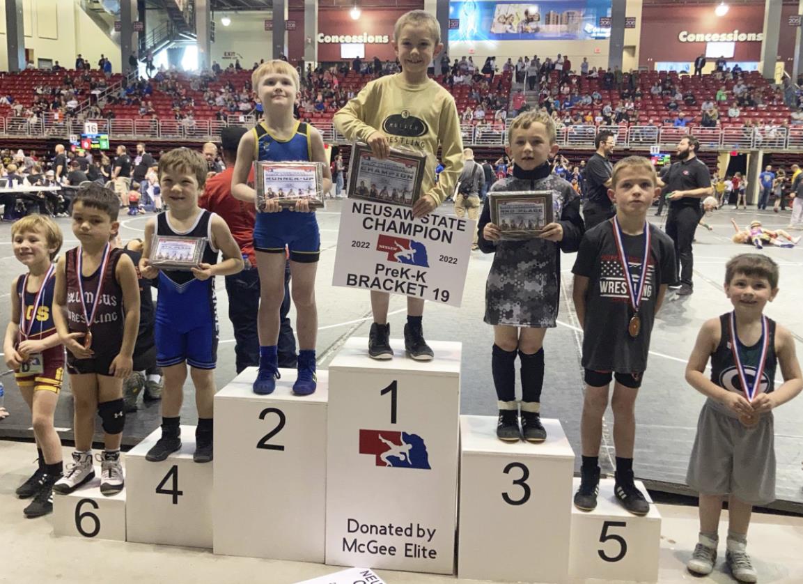 Grady Phipps stands on top of the podium last Sunday at the NEUSA State Wrestling meet. Steven Dent