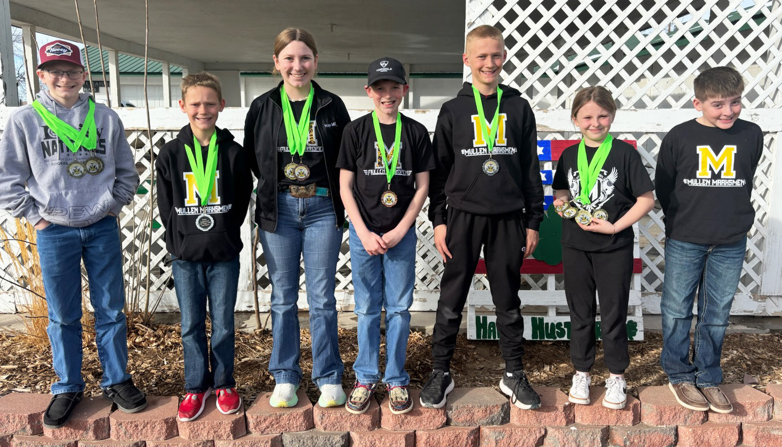 Mullen Marksmen in Chadron, l-r: Oakes Miller, Eli Barnes, Hope Miller, Duke Miller, Teal Peterson, Sadie Hoyt, Zach Hicks. Not pictured: Marcus Lattin, Hunter Gray. Gerri Peterson