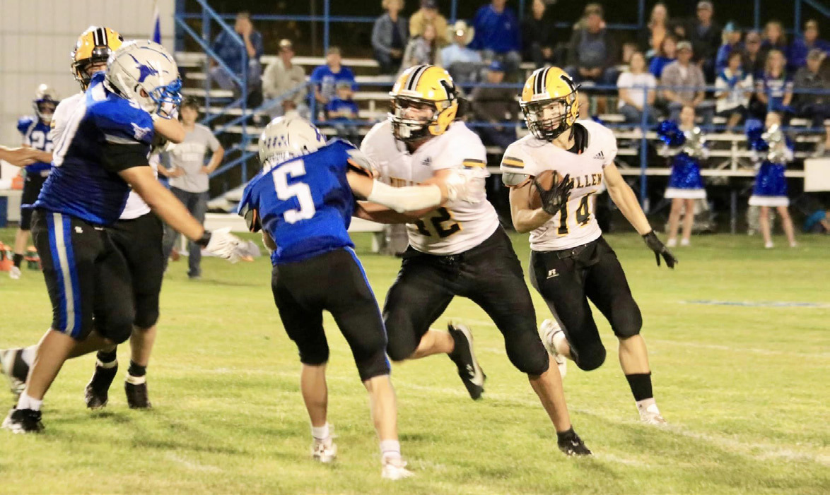 Alex Werner follows the block of Tate Kvanvig for more yardage last Thursday night in Hyannis. Carolee Brown