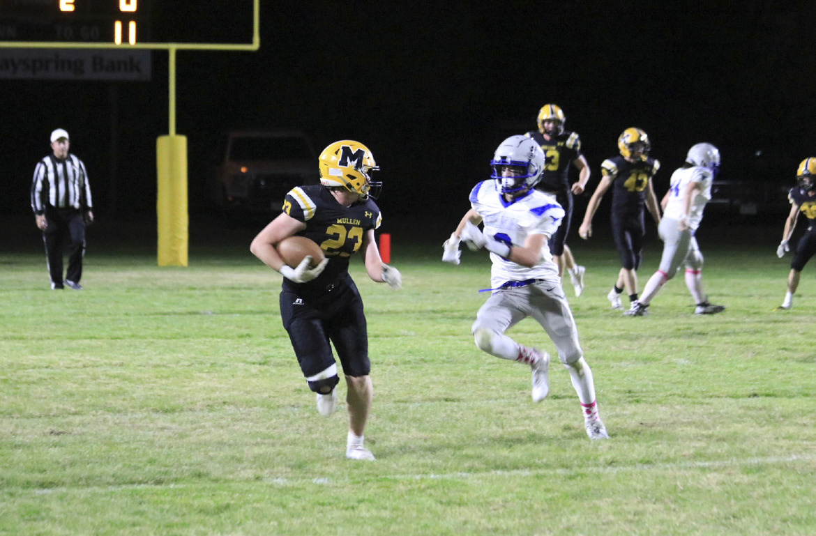 Ethan Hardin runs the ball after catching a Chase Gracey pass against Hyannis last week in the first round of playoffs. Carolee Brown