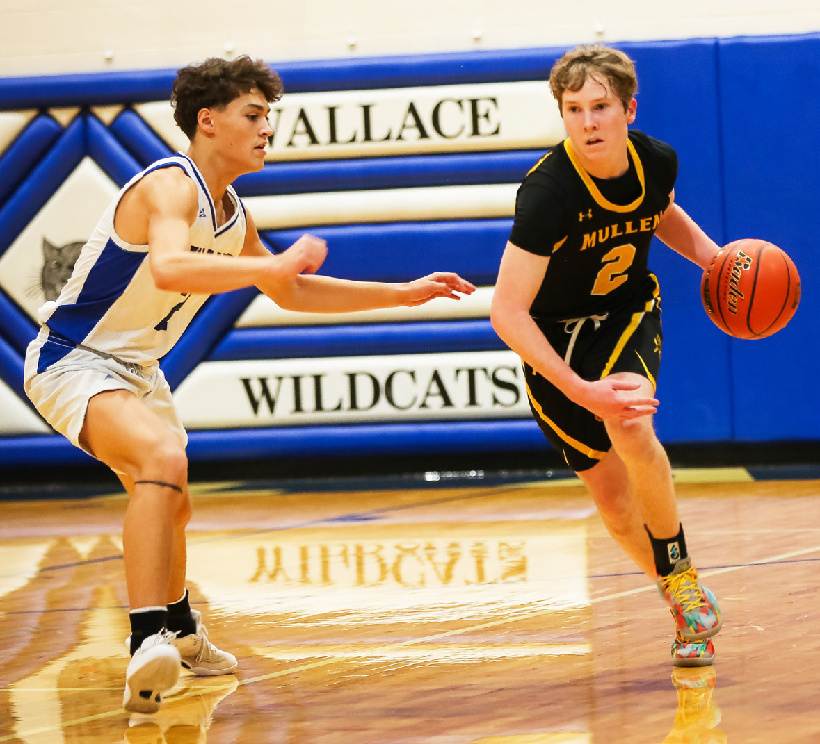 Brandon Hardin brings the ball up the court at Wallace. Megan Andersen