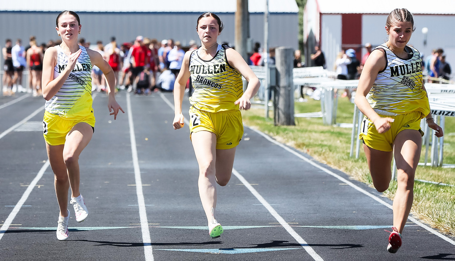 L-r: Allie Boyer, Kalli Licking and Ella Rice compete in the 100 meter dash prelims at Arnold last Friday. Megan Andersen