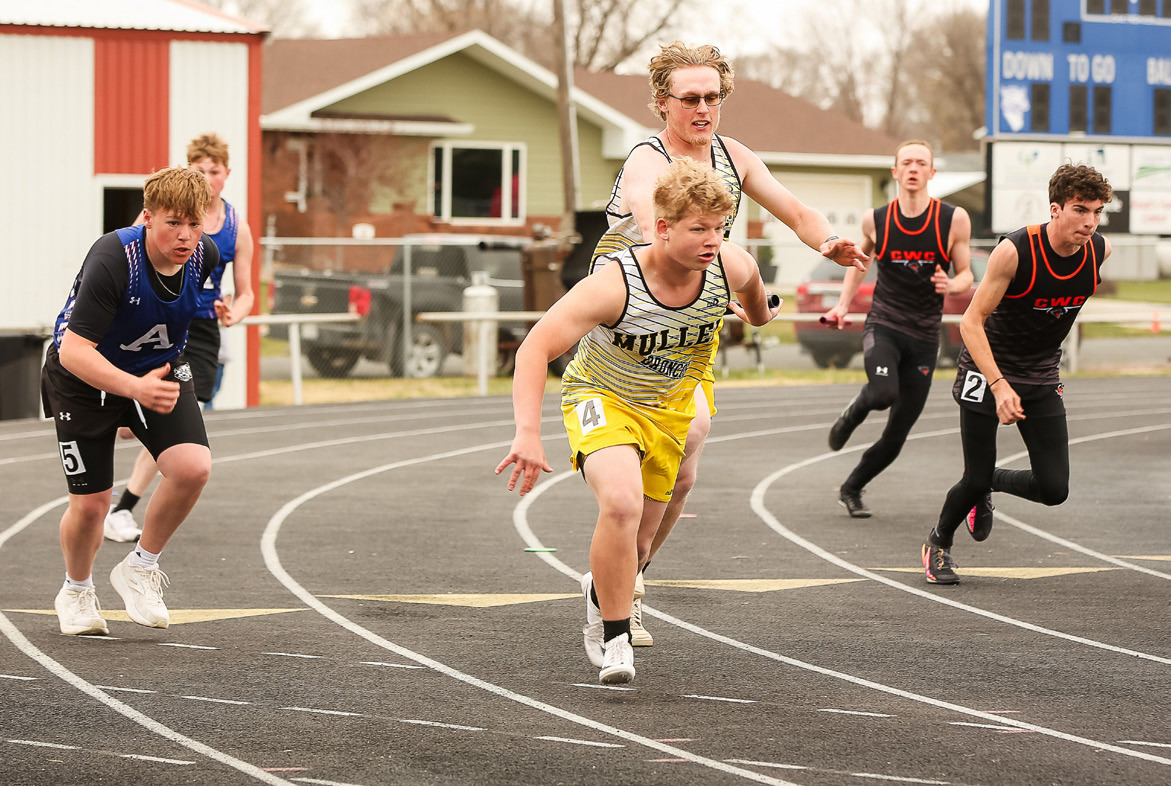 Daniel Wright hands off the baton to D.J. Coetzee during the 4x100 Throwers Relay in Arnold. Megan Andersen