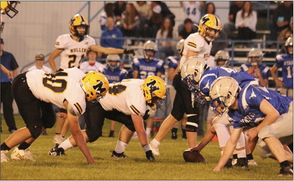 Defensive linemen James Kessler and Owen Thorberg wait for the snap in Hyannis last Friday. Carolee Brown
