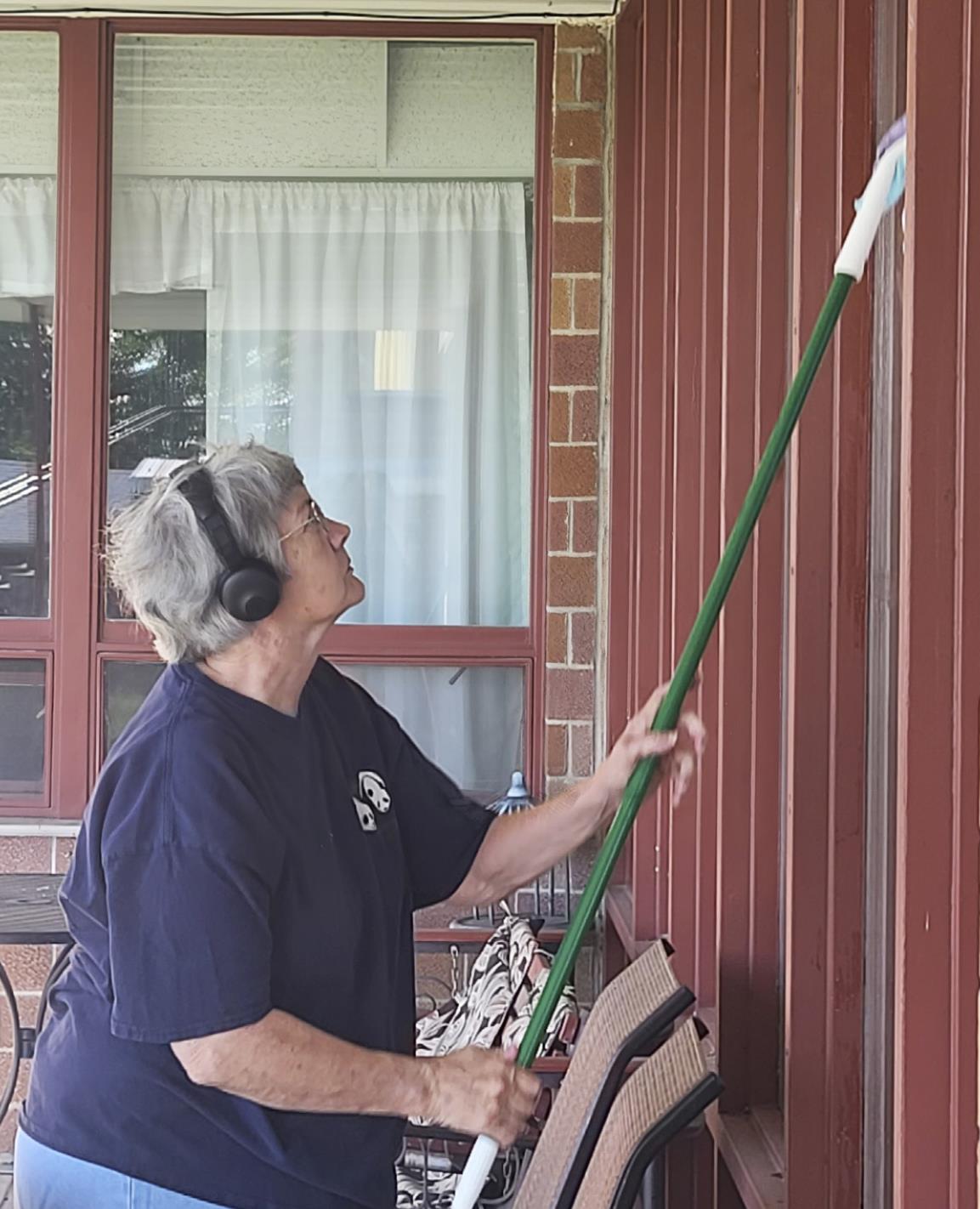 Connie Devine cleaning the windows! We appreciate it so much!