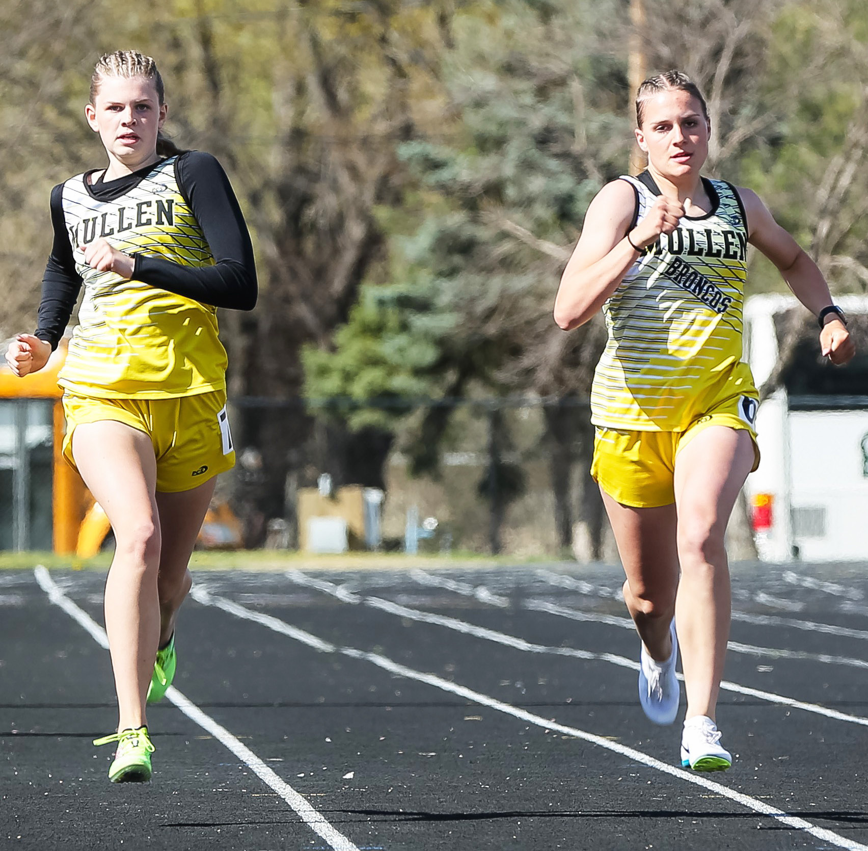 Freshmen Chloe Newman (left) and Brynne McCully finished 5th and 6th in both the 200 (pictured) and the 400 last week. Megan Andersen