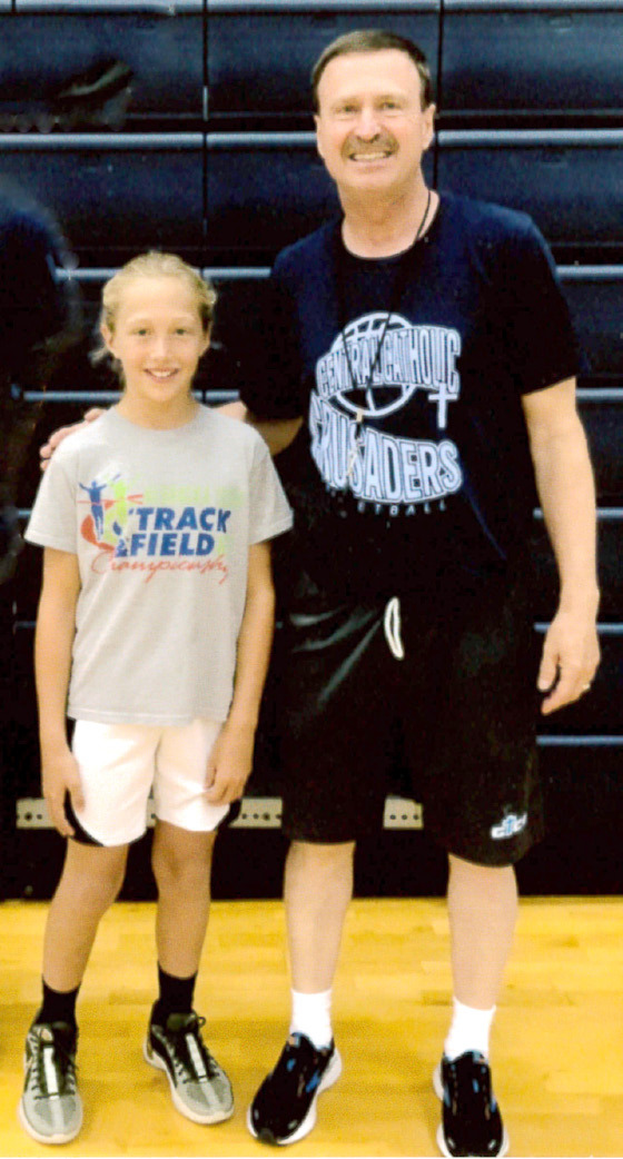 Mullen fourth grader Emri Dent attended the Mike Trader Mid-America Basketball Camp at Grand Island Central Catholic this summer. She brought home multiple awards in her Girls Midget League division: Most Valuable Camper, Three Point Champion, Scoring Leader for the Week, Nightly Scoring Leader, Nightly Assist Leader and All Star. Emri is pictured at the camp with Bill Gavers. courtesy photo
