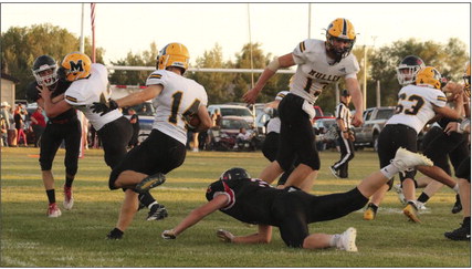 Alex Werner follows his blockers (#43 Tate Kvanvig, #13 Chase Gracey and #63 Jarren Forsen) and looks for more yardage last week in Tryon. Carolee Brown