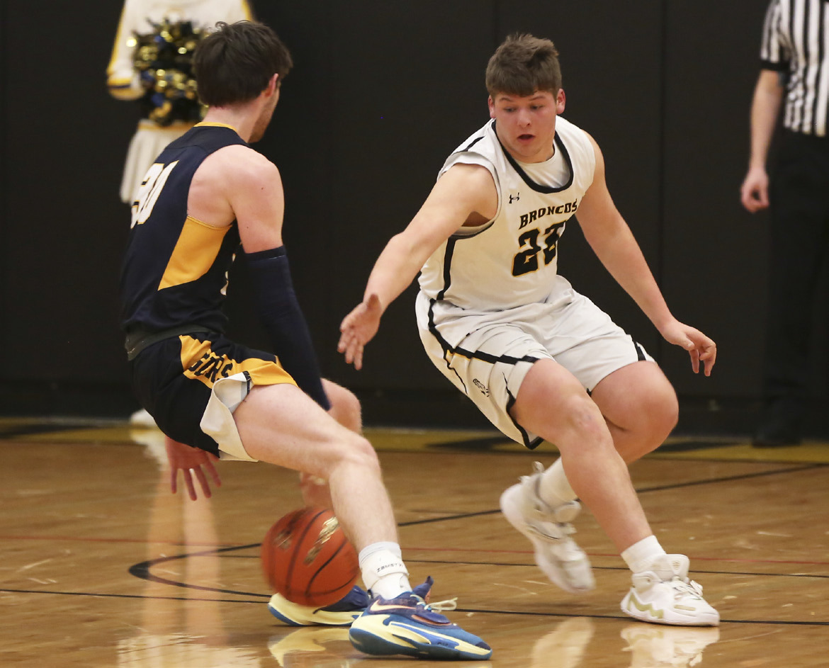 Deacon DeNaeyer on defense against Paxton in the subdistrict final game on Feb. 23. Megan Andersen