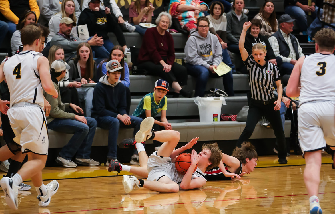 Brandon Hardin motions for a time out from the floor against Sandhills Valley on Feb. 8.