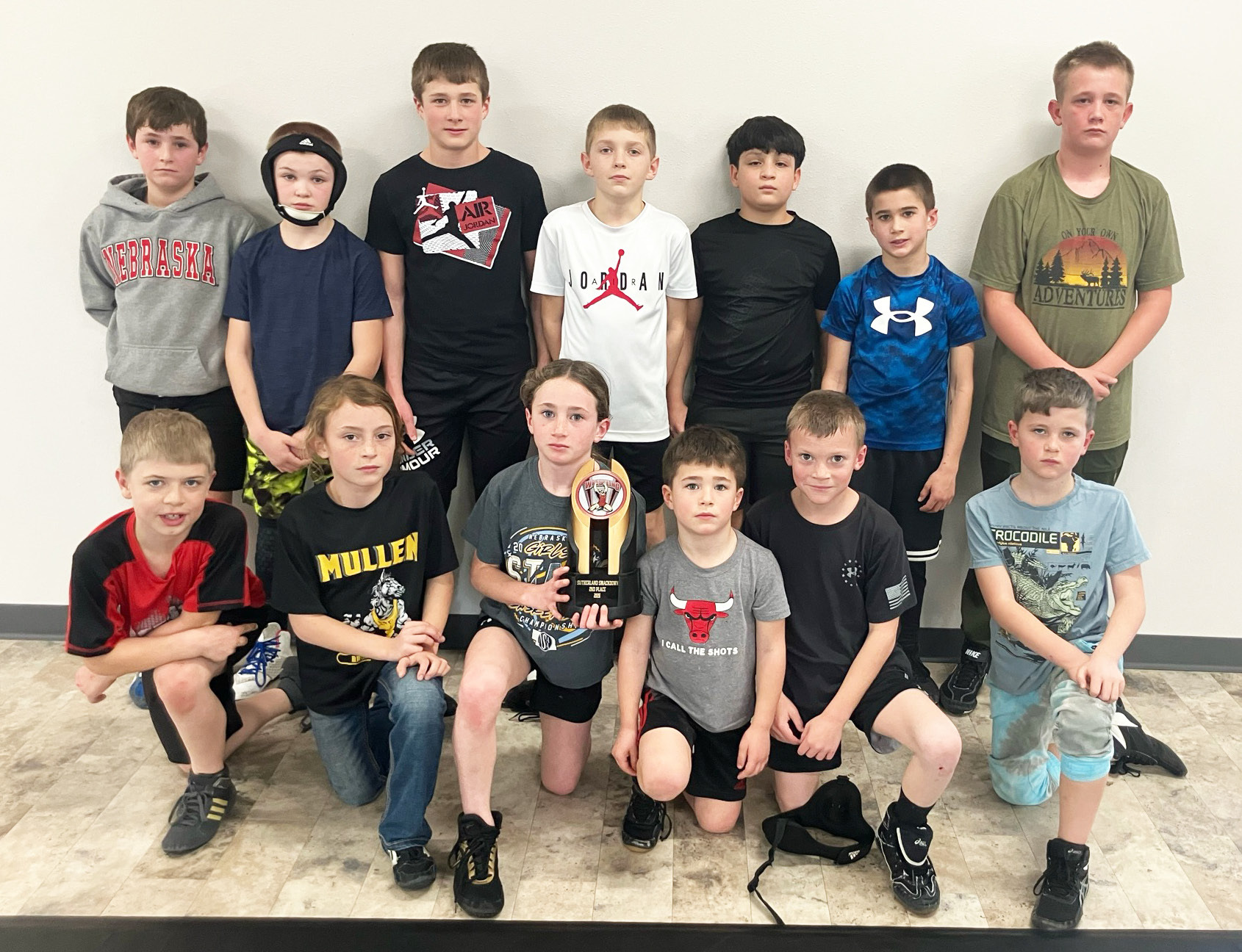 Most of the Mullen youth wrestlers who competed in Sutherland with their team trophy. Back l-r: Tuff Pettit, Tripp Jewell, Cylas Dent, Kyler Marsh, Lorenzo Gonzalez, Tru Mundorf, Caleb Deibler. Front: Killian Kearns, Bryndal Greeley, Dailie Dent, Brek Dent, Trent Cox, Tate Phillips. Steven Dent