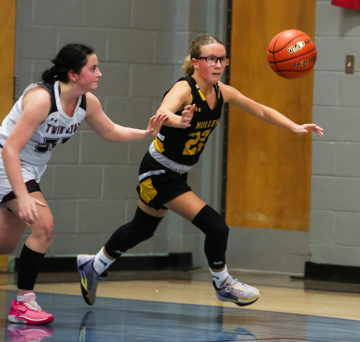 Riley Hegland keeps her eyes on the ball as she chases it down against Twin Loup last week. Megan Andersen