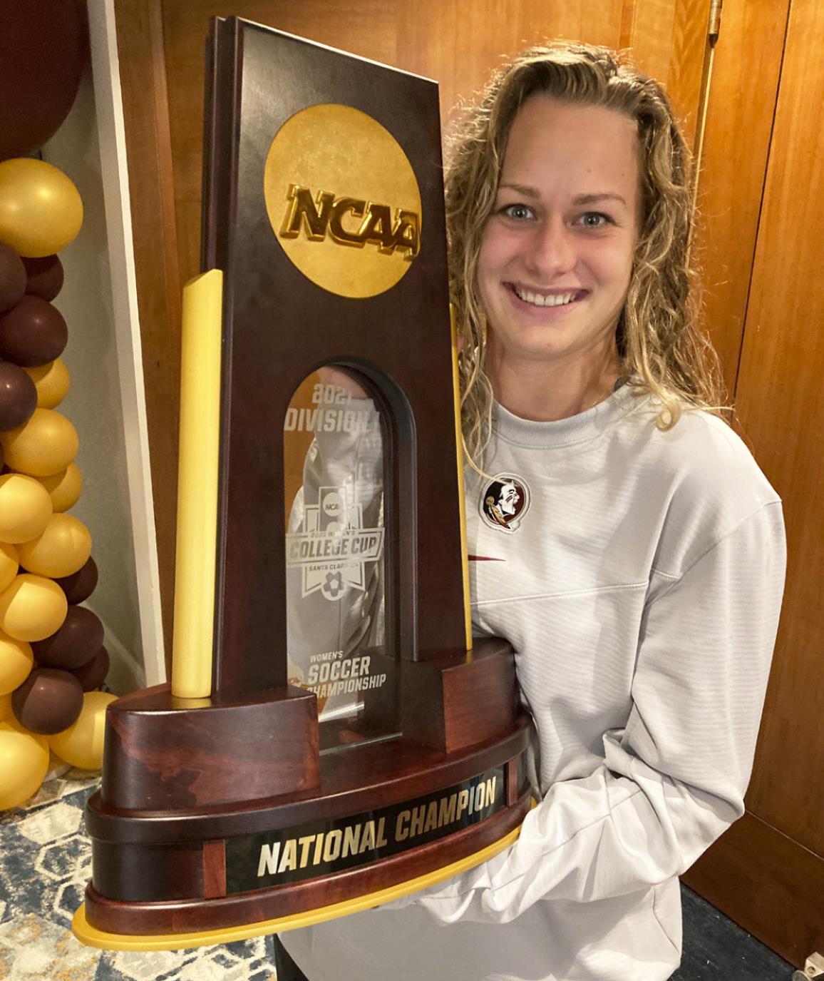 Jaelin Howell with her team’s NCAA National Champion trophy. courtesy photo