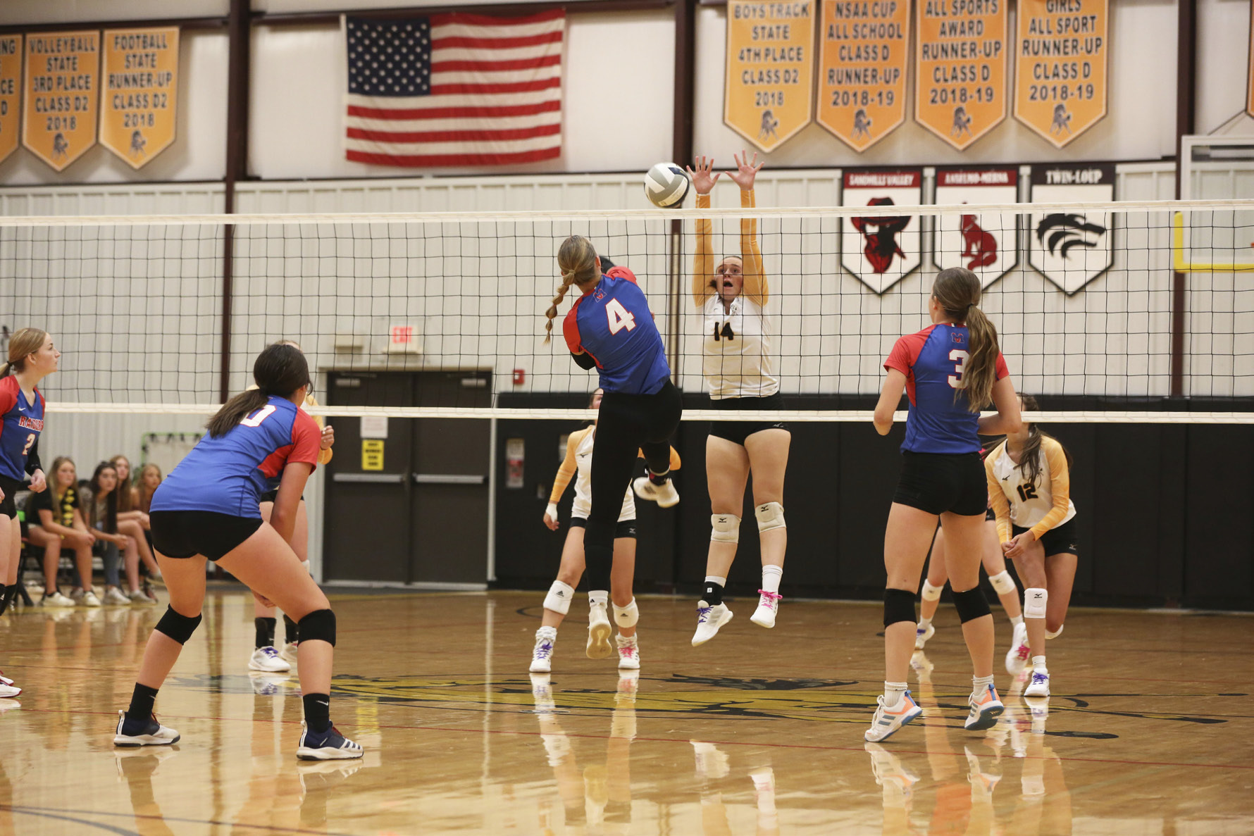 Senior Jadyn Andersen goes up for a block in the Broncos’ season opener against Medicine Valley. Megan Andersen