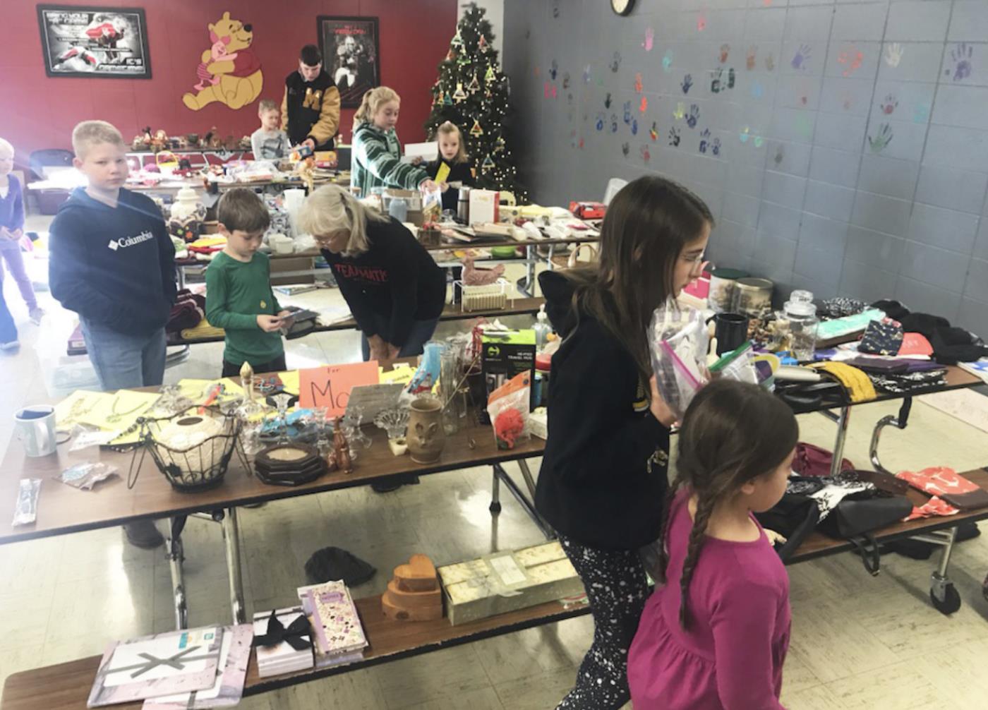 Elementary students purchase gifts for family members