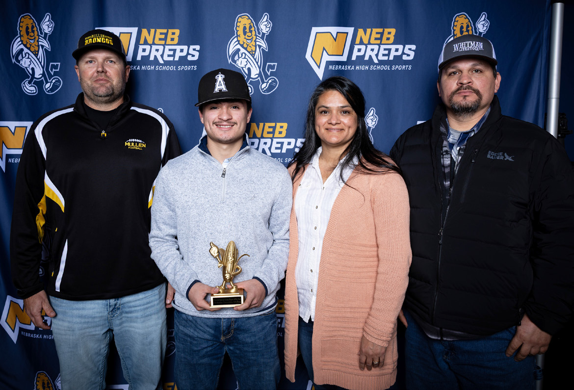L-r: Mullen Bronco Head Football Coach Wade Marsh and Nicholas Gonzalez with his parents, Lorena and Manuel Gonzalez. courtesy photo