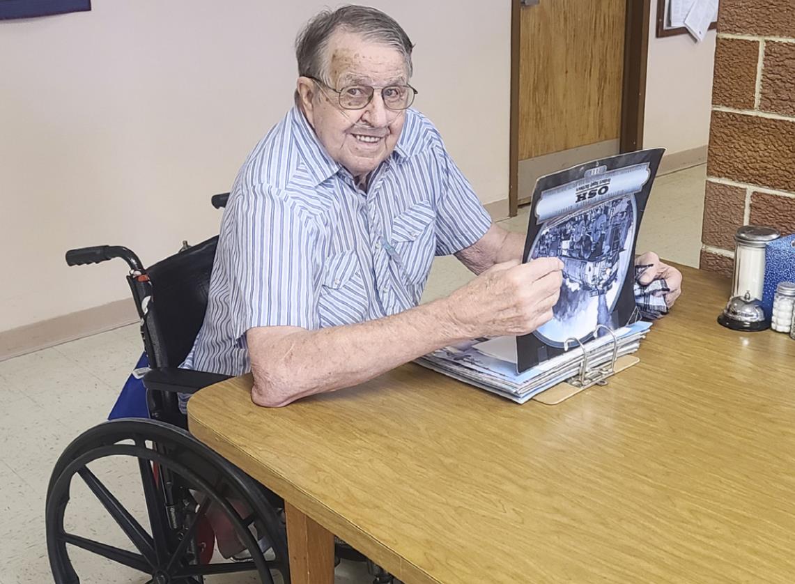 Robert Prentice enjoying the train book brought in by Ken Clark.