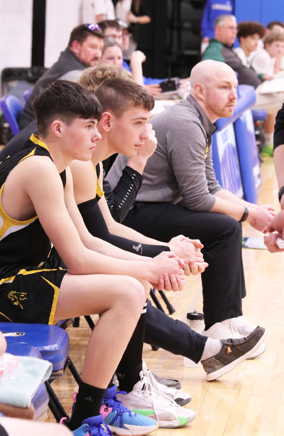 L-r: Cian Connealy, Hunter Brown, Coach Brad Wright (hidden) and Coach Dan Young intent on the subdistrict action. Carolee Brown