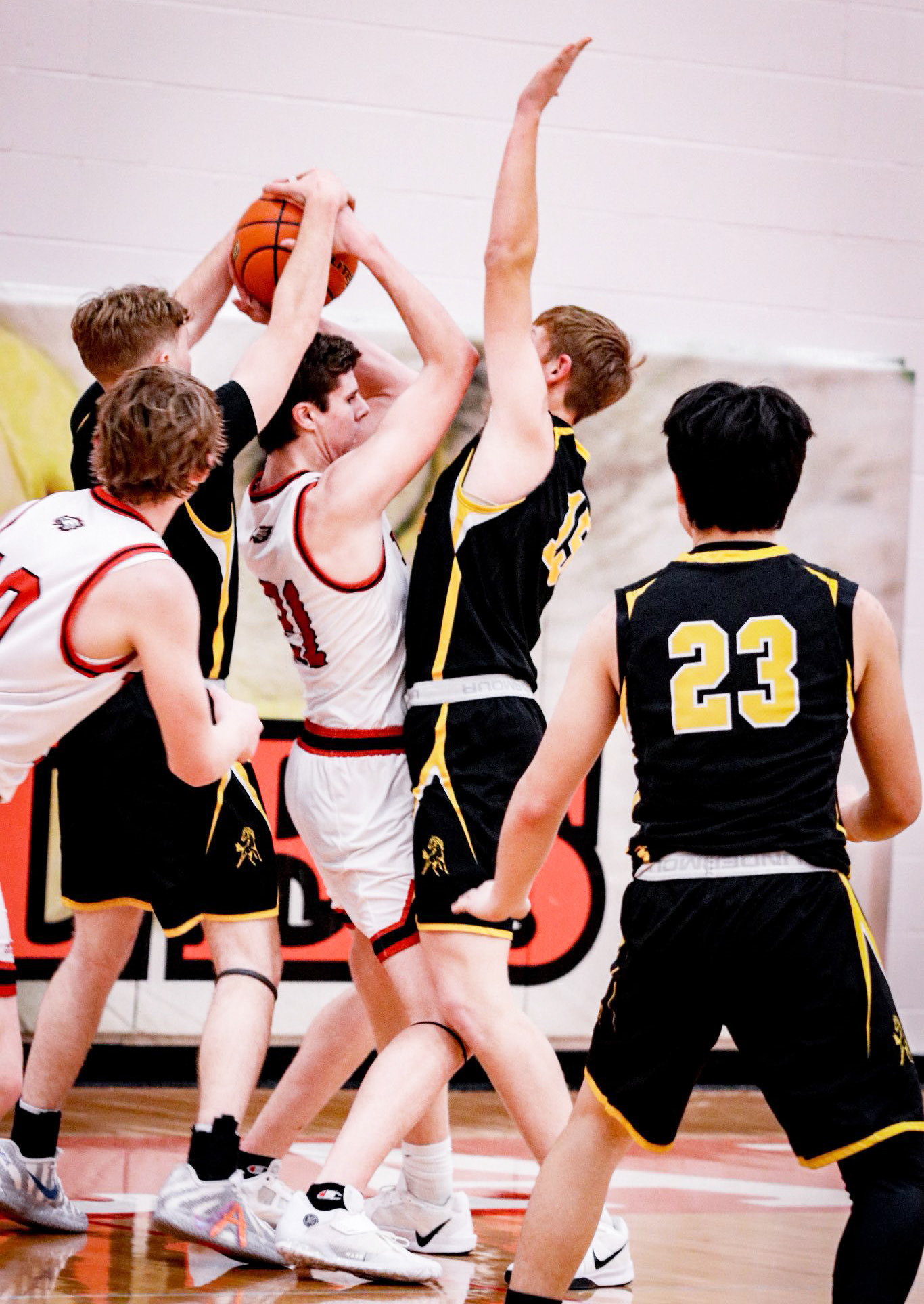 Brandon Hardin (left) and Jackson Vinton trap a Brady player. Carolee Brown Photography