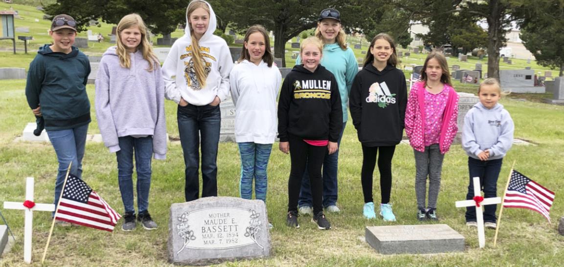 Girl Scouts decorate graves