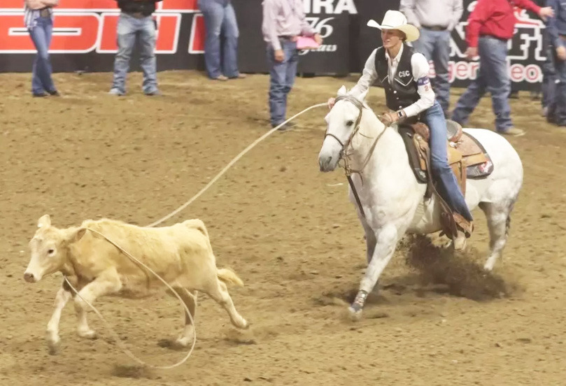 While riding her gray gelding, Tom, Chadron State College senior Brooke McCully of Mullen roped her calf in 2.4 seconds to place third in the final go-round of breakaway roping at the College National Finals Rodeo in Casper, Wyoming, last Saturday night. Steph Miller