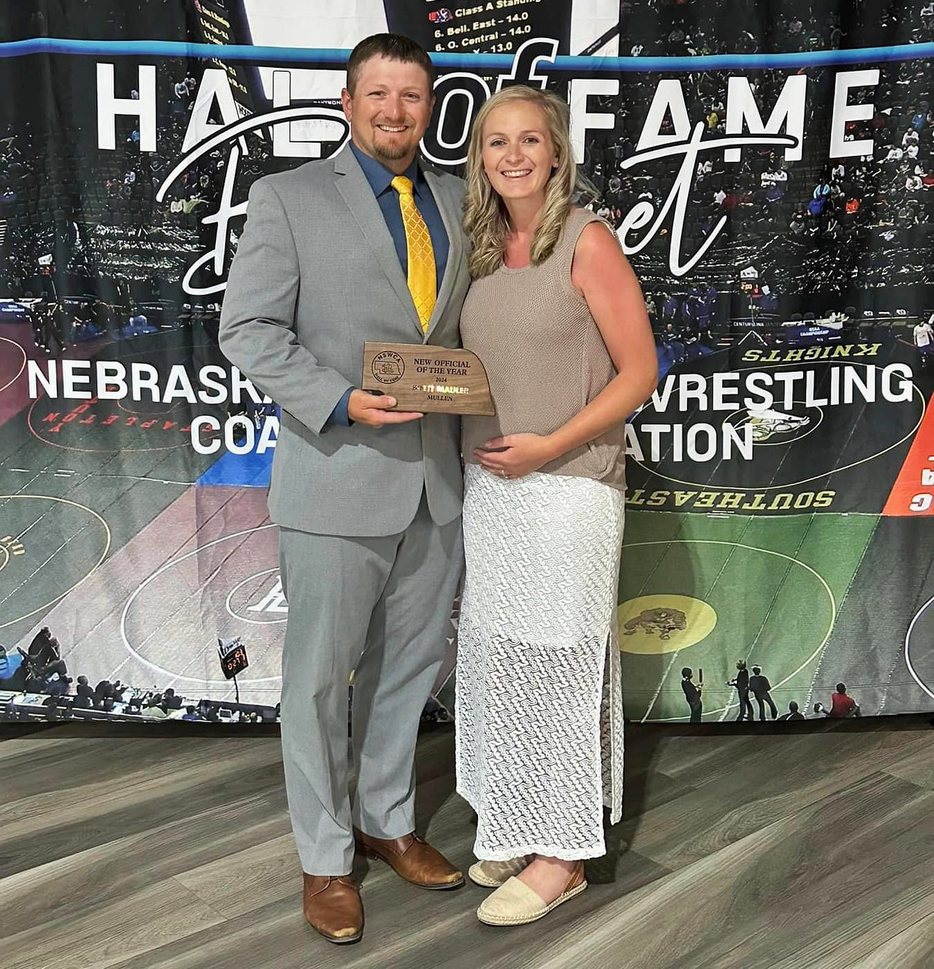 Brett Mauler of Mullen, pictured with his wife Shelby, was awarded the Nebraska Scholastic Wrestling Coaches Association New Official of the Year on June 7. Nominations for this award were made by coaches and then voted on by the members of the NSWCA. He officiated the All Star Red/Blue spotlight dual in Grand Island with NSWCA Official of the Year Austin Coufal of Howells. courtesy photo