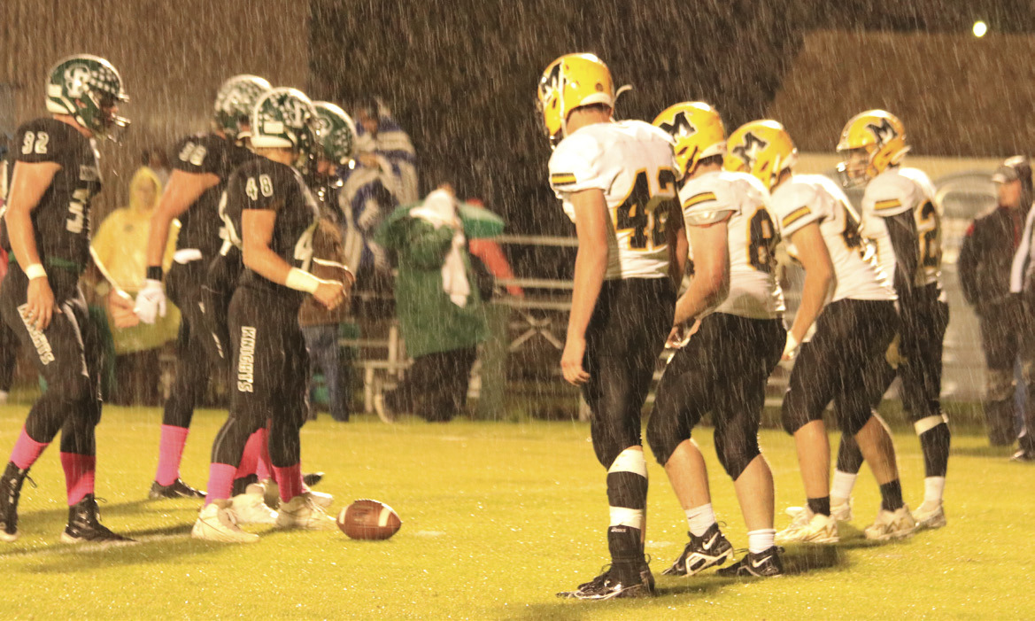 The Broncos get ready for defense at Dunning in the rain last Thursday night. Carolee Brown