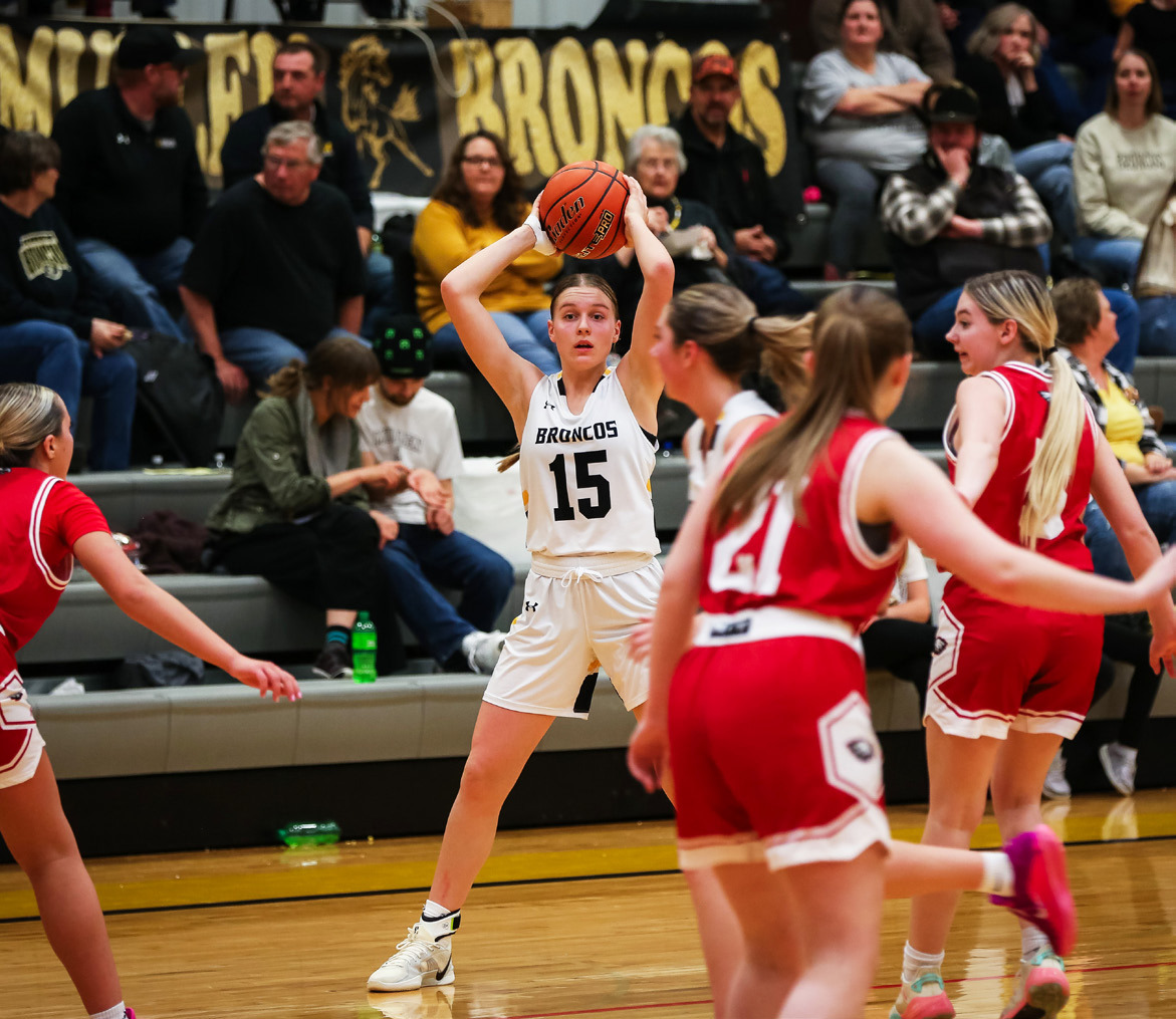 Brynne McCully watches her teammates run the offense last Friday against Brady. Megan Andersen