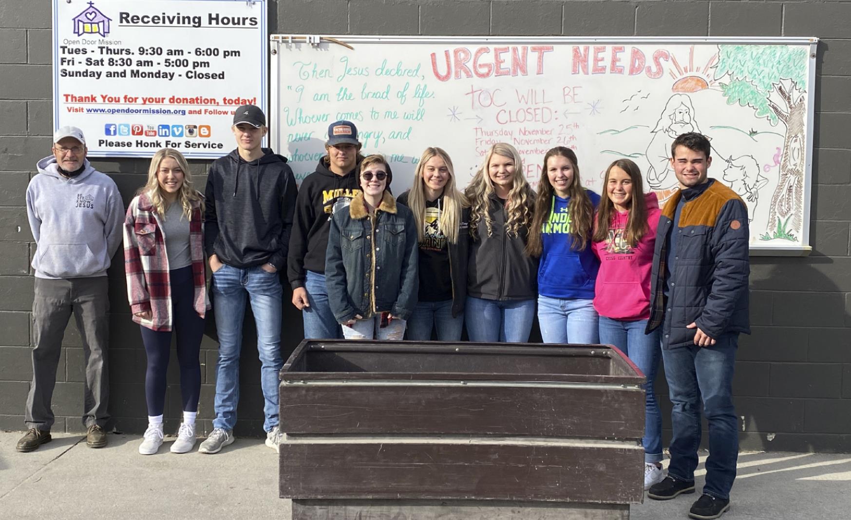 NHS members pictured with the Open Door Mission representative, l-r: Taylor Svoboda, Clayton Moore, Deacon DeNaeyer, Hailey Phipps, Alli Loughran, Faith Miller, Jordyn McDowell, Callie Coble, Samuel Coble. Megan Andersen