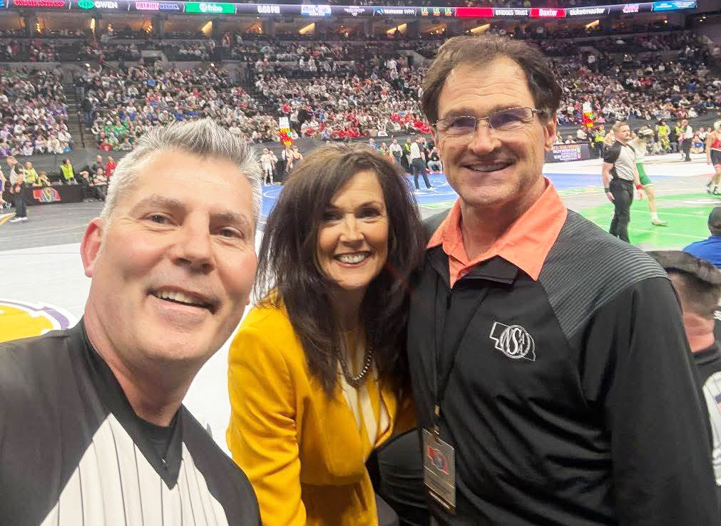 Bill and Robin Phipps at State Wrestling with Dale Bean of Kearney (left) who was honored for 25 years as a referee. courtesy photo