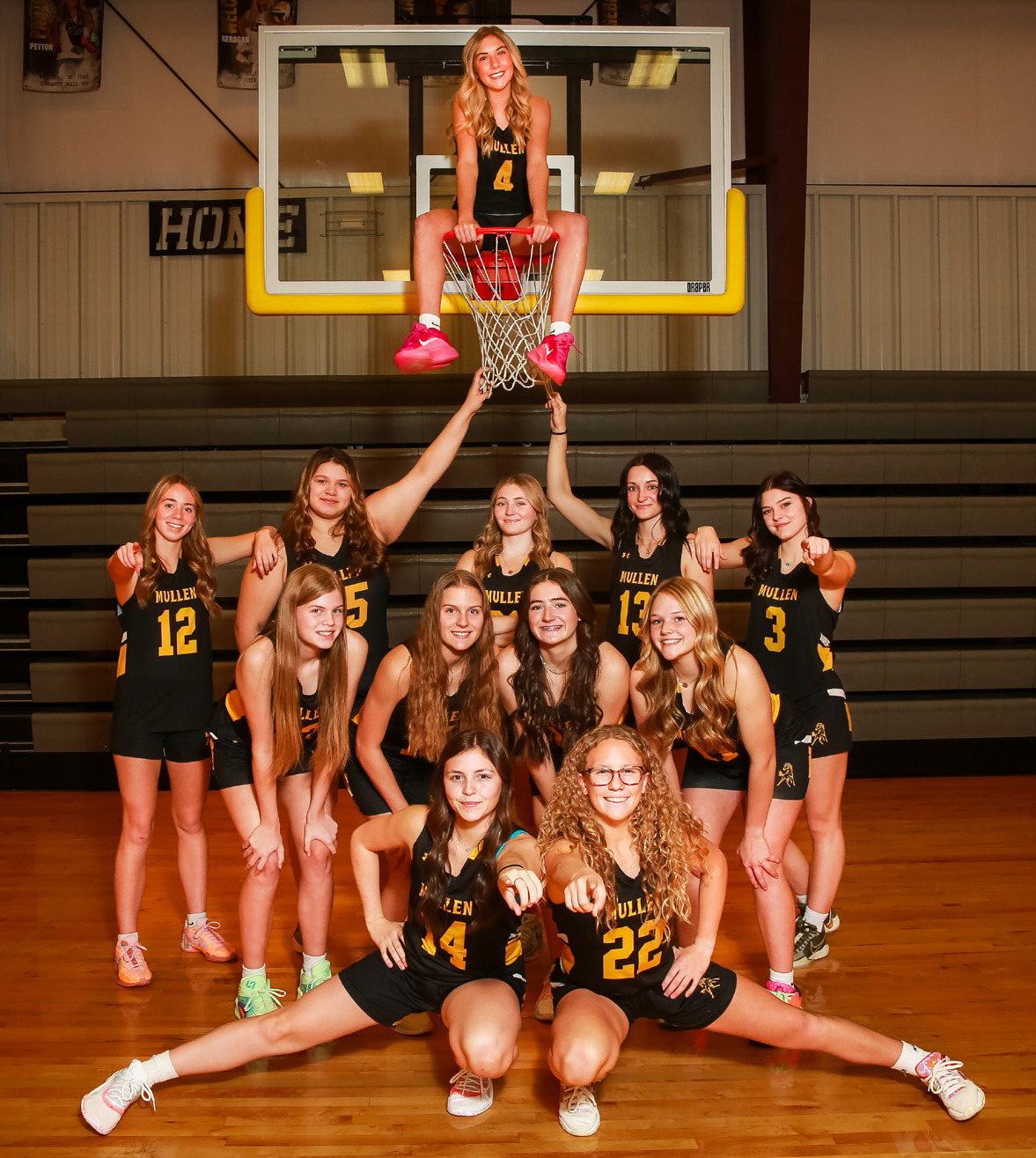 Girls basketball: Peyton Paxton on the hoop, back l-r: Harper Andersen, Mia Flores-Green, Hayley Donohoe, Fayth Brown, Georgia Wingebach. Middle: Chloe Newman, Brynne McCully, Jenna Donohoe, Emerson Thorberg. Front: Kalli Licking, Riley Hegland. Megan Andersen Photography