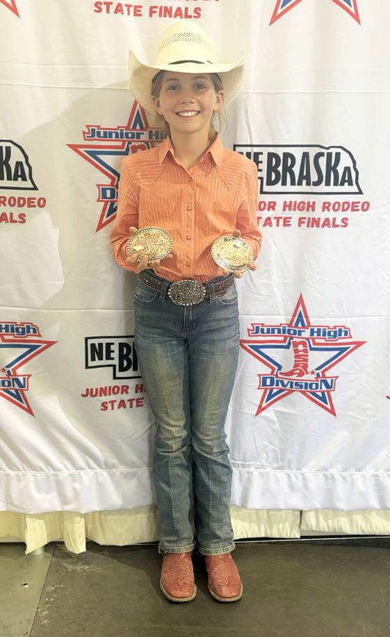 Abbigail Mundorf with her barrel racing buckles at State Finals. Katie Dent