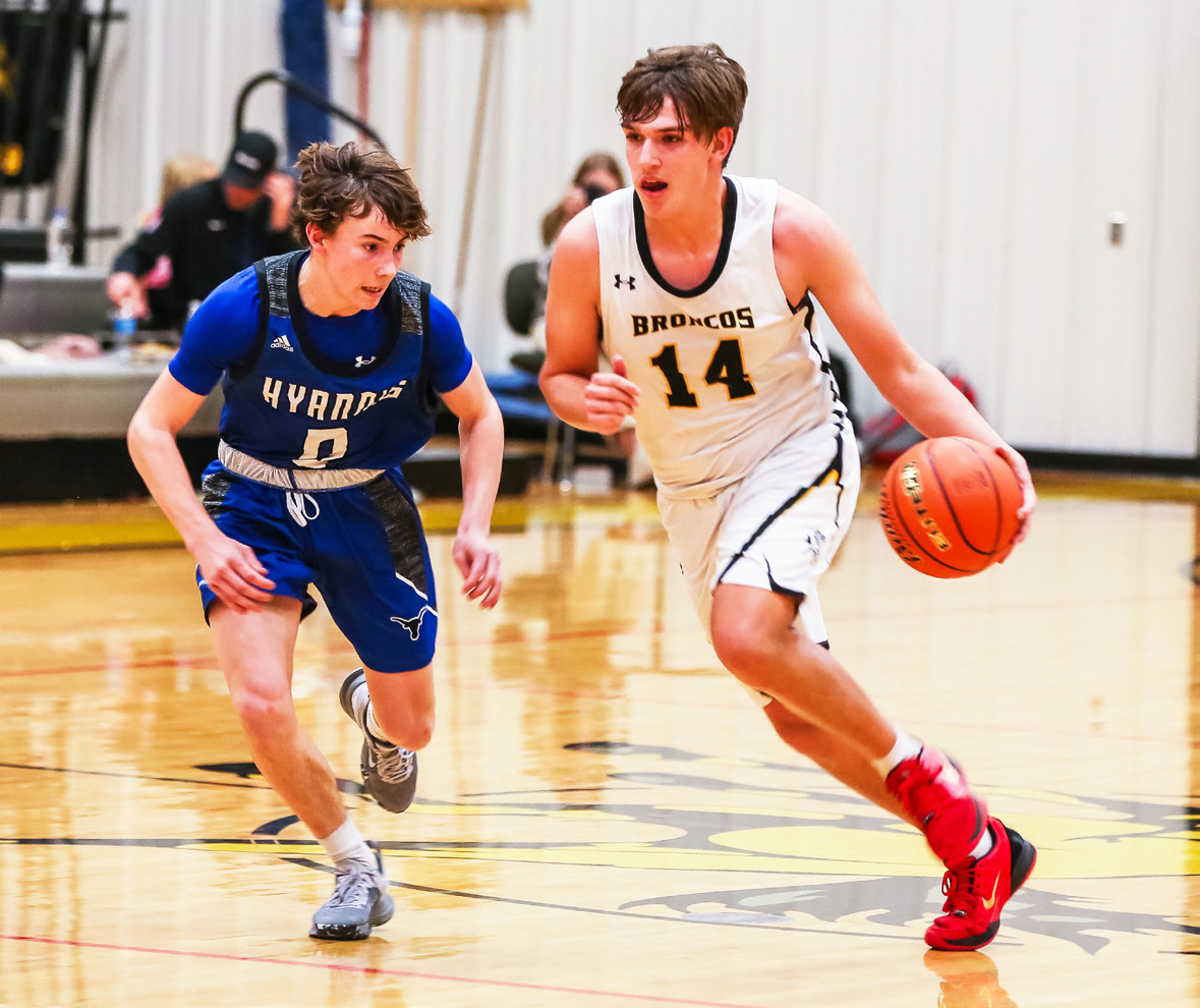 Jacob Walker takes the ball up the court against Hyannis. Megan Andersen